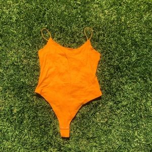 orange ribbed garage bodysuit